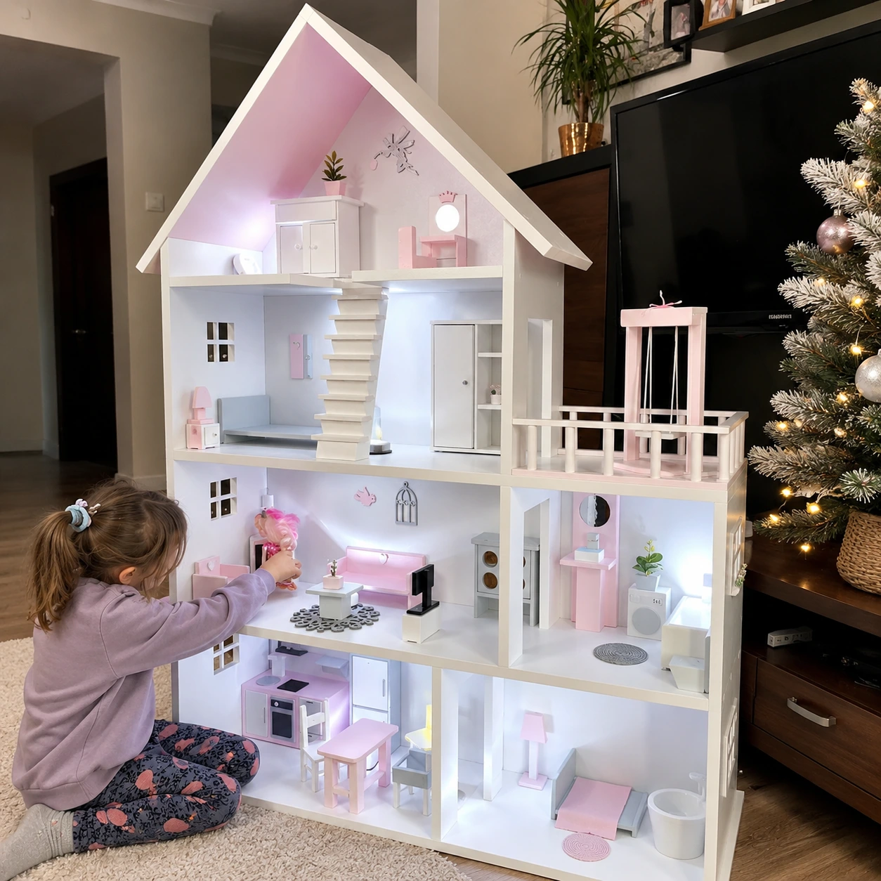 Child playing with Kiddies Kingdom dollhouse